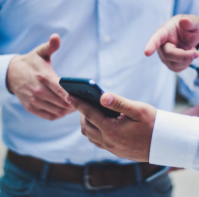person holding black smartphone