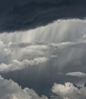 white clouds over mountain during daytime